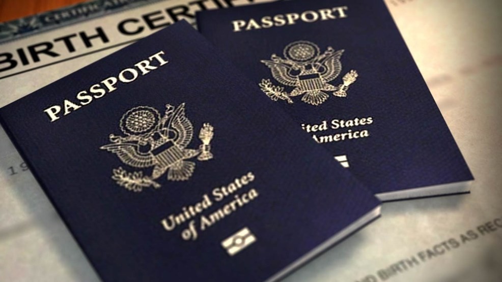 Two passports laying on a table.